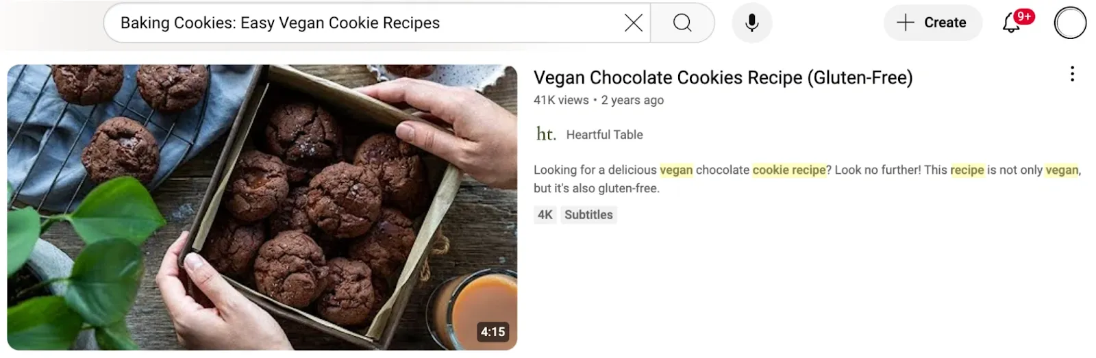 Thumbnail of a YouTube video titled 'Vegan Chocolate Cookies Recipe (Gluten-Free).' The image shows a close-up of chocolate cookies in a box with a hand holding the box, and a cup of tea or coffee nearby